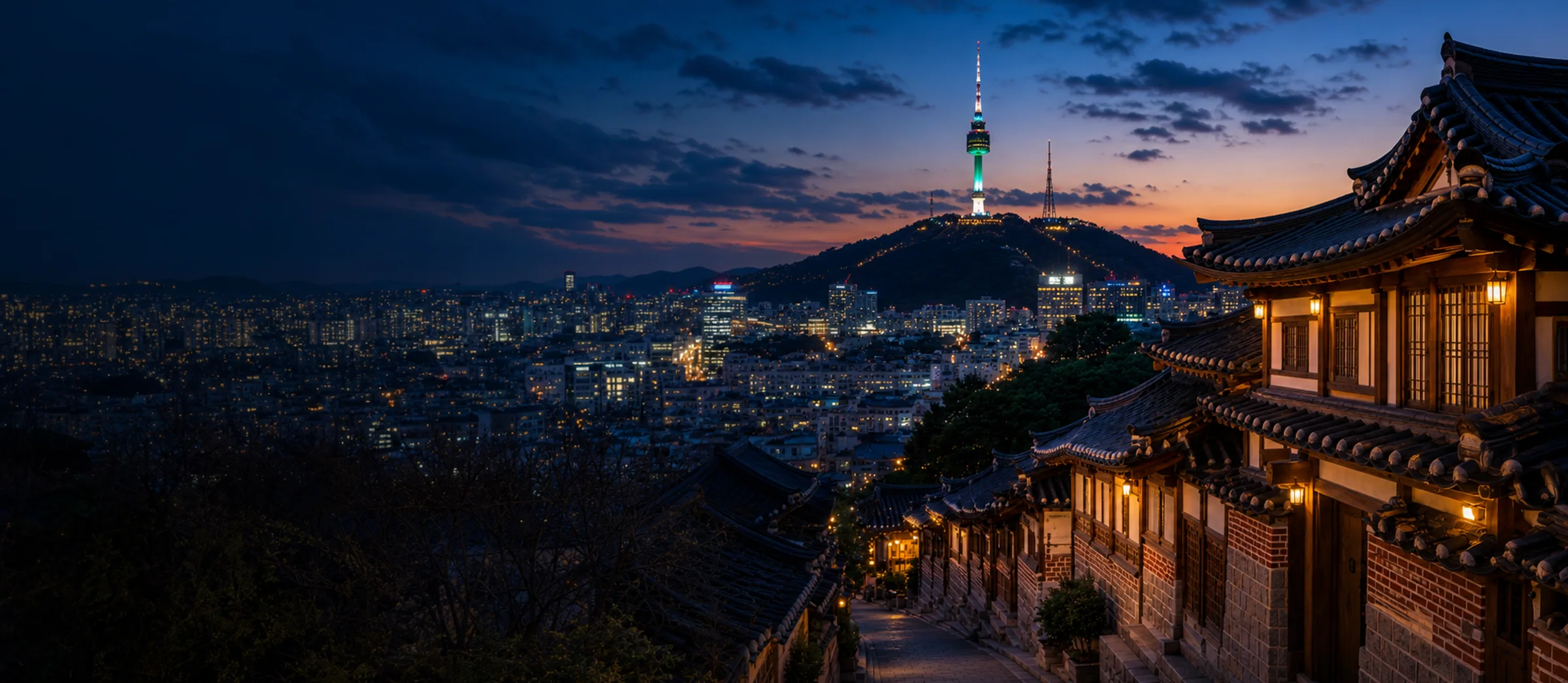 Seoul skyline, Namsan Seoul Tower, and hanok street at blue hour